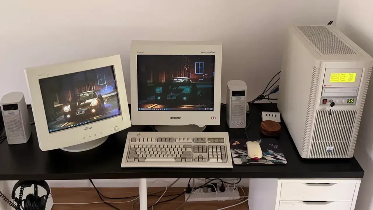 A late-1990s desktop computer setup with dual CRT monitors