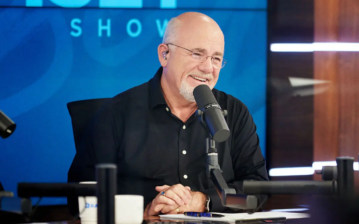 Dave Ramsey speaking into a studio microphone