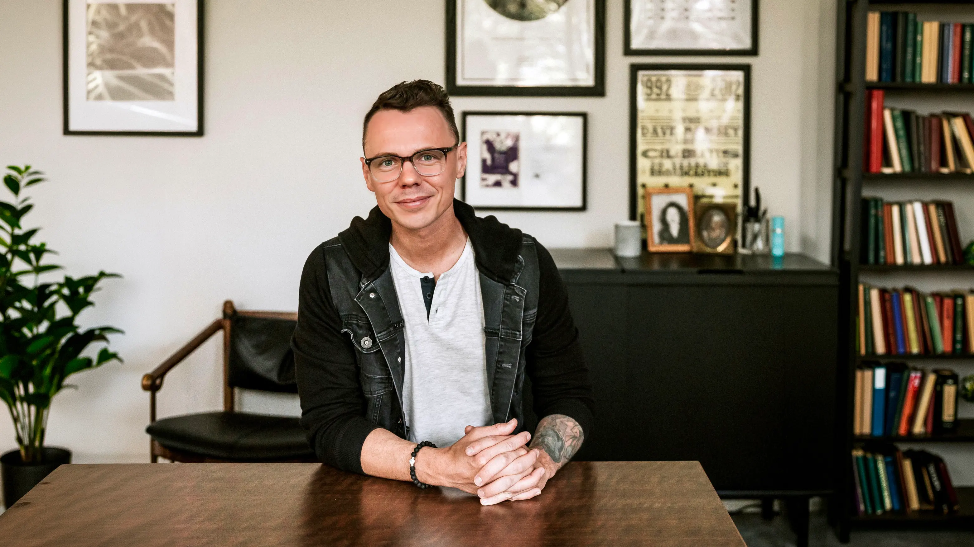 Robbie Poe seated at a desk in his office